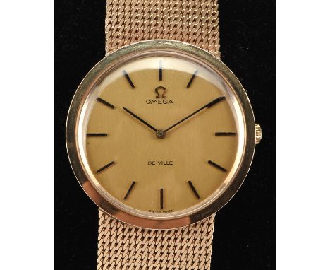 Omega A gentleman's 'De Ville' gold wristwatch, the brushed gold signed dial with baton hour markers, fitted with a signed ma