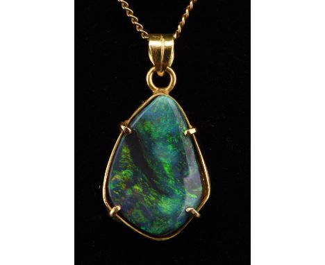 Boulder opal pendant, with open back measuring 13mmx18mm, in an 18 ct border with chain, measuring 70cm long stamped 18 ct Co