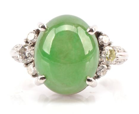 Jade and diamond ring, central un treated oval cabochon jade stone stated as 7.92 carats measuring 13mmx10mmx6mm on GIA certi