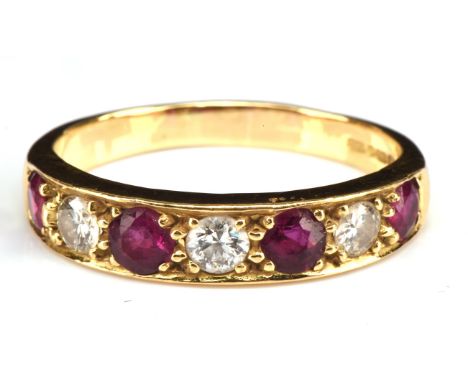 Ruby and diamond seven stone ring, set with four round cut rubies, estimated total ruby weight 0.80 carats and three round br