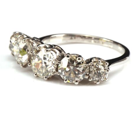 Five stone diamond ring, set with old cut diamonds in a claw setting, estimated total diamond weight 2.95 carats, stamped pla