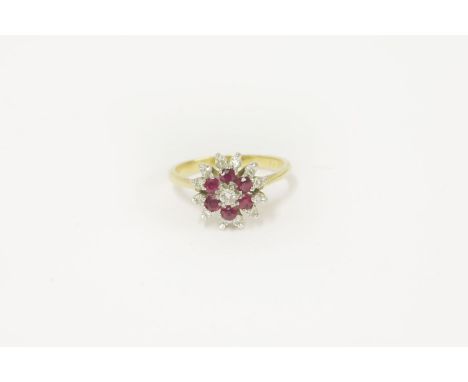 A gold diamond and ruby cluster ring, marked 18ct, size J 3.25g