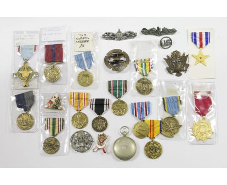 Thirteen US medals, including Airforce, Legion of Honour and eight badges and a compass