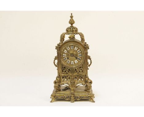 A pierced brass mantel clock