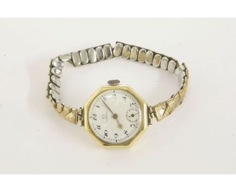A ladies 18ct gold Omega mechanical octagonal watch, with white enamel dial, Arabic numerals and subsidiary seconds on later 