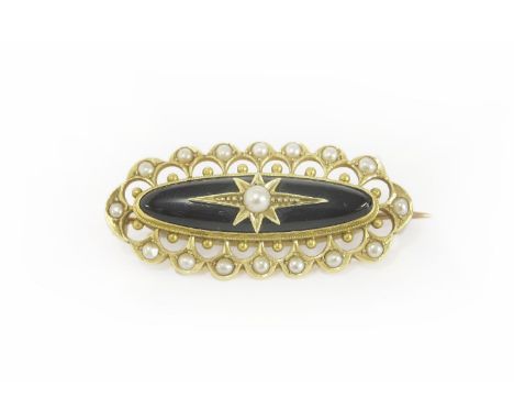 A Victorian gold and black onyx cabochon and seed pearl brooch, the centre seed pearl set to an inlaid star, with a seed pear