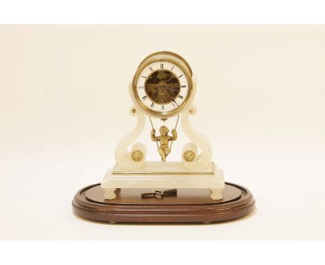 An alabaster mantel clock, with cherub on a swing pendulum