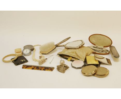 An early 20th century silver and engine turned enamel powder compact, of rectangular form, a further similar octagonal exampl