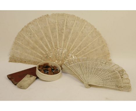 A mother of pearl fan, a bone example, two aide-de-memoir, and a quantity of buttons
