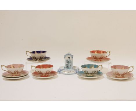 An Austrian porcelain vesta, with column centre on a dish base, and a set of seven Aynsley cups and saucers, with floral deco