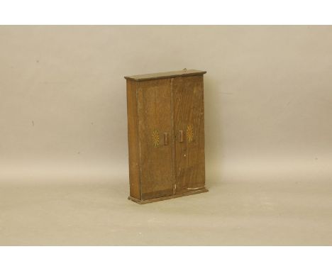 An Edwardian Harrods oak wall mounted tool cabinet, 62cm highProvenance:  Standen Hall, Clitheroe