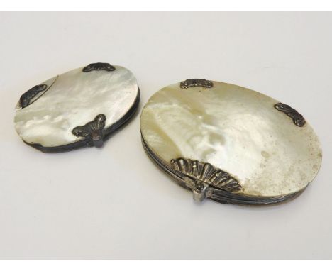 A mother of pearl cased magnifying glass, with white metal mounts, together with a smaller magnifying glass (2)Provenance:  S