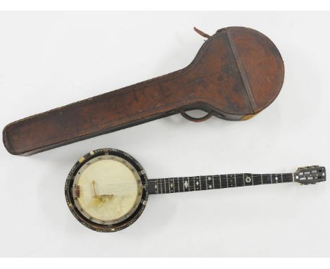 A banjo with mother of pearl inlaid fret board and rim, in brown leather hardcase