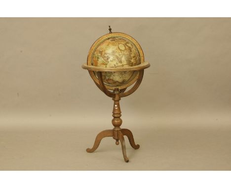 A floor standing beech wood framed terrestrial globe, on stand, 88cm