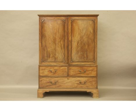 An 18th century mahogany linen press, with integral original trays, three drawer base, on bracket feet