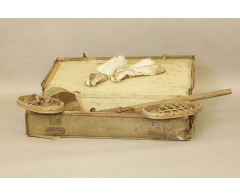 A vintage canvas and leather trunk, housing snow shoes, etc, the case labelled L Bullock & Son, Clitheroe and polar skin mitt