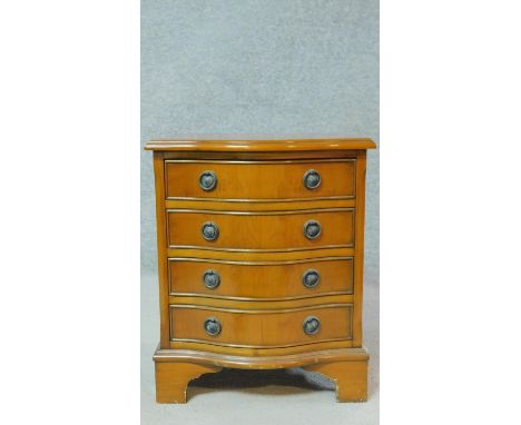 A 20th century mahogany small chest of four drawers on bracket feet. H.54 W.42 D.33cm 