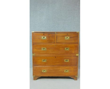 A 19th century two section teak brass bound military chest with two short over three long drawers on bracket feet. H.102 W.91