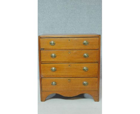 A Georgian mahogany chest of four graduating drawers of compact size on bracket feet. H.81 W.71 D.39cm 