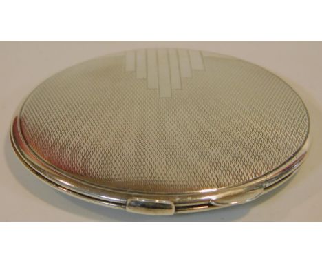 A sterling silver Art Deco circular compact mirror with engine turned decoration. Hallmarked: B&amp;C for W I Broadway &amp; 
