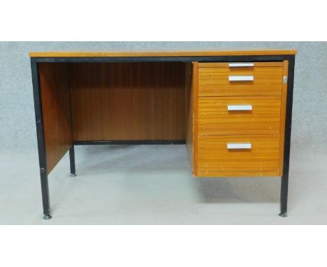A mid century vintage teak and metal framed desk with a bank of three graduating drawers. H.71 W.107 D.64 