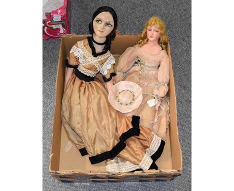 Circa 1930s Boudoir Dolls, comprising a fabric mounted doll with painted face, black hair, wearing a brown and black trimmed 