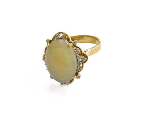 An Opal and Diamond Cluster Ring, stamped '14K' and '585', finger size N1/2Gross weight 6.4 grams.