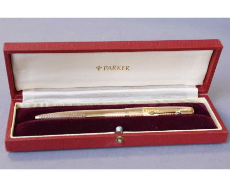 An Elizabeth II Gold Parker Ballpoint-Pen, London, 1967, 9ct, with an engine-turned finish, in fitted gilt-tooled red leather