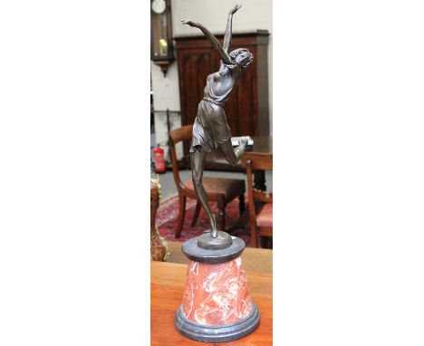 After Bruno Zach: an Art Deco style bronze and marble figure, 65cm high