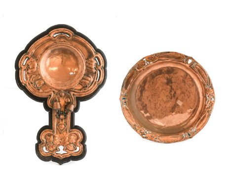An Arts &amp; Crafts Copper Twin Light Wall Sconce, with embossed decoration, mounted on an ebonised back, unmarked, 61.5cm h