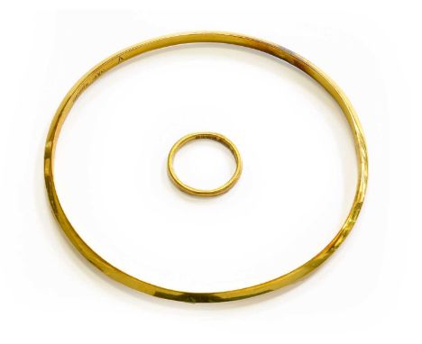 A 22 Carat Gold Band Ring, finger size I1/2; and A 9 Carat Gold Bangle, inner diameter 7.2cmRing - 2.1 grams. Bangle - 4.6 gr