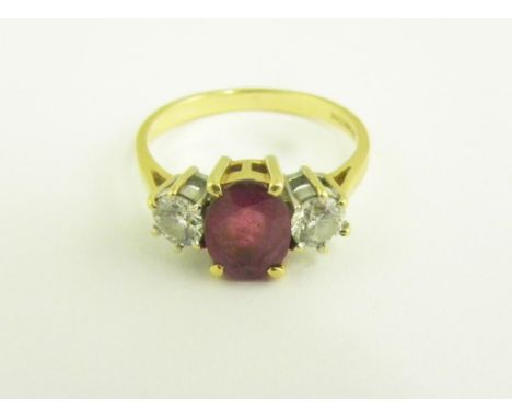 A RUBY AND DIAMOND THREE STONE RING, IN 18CT GOLD, 3G