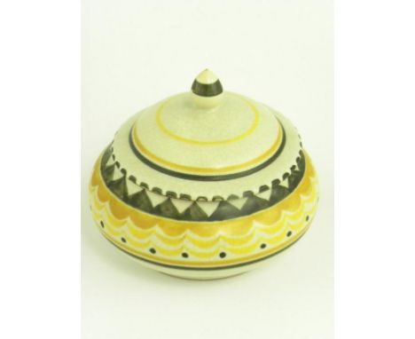 A POOLE POTTERY RED BODIED EARTHENWARE BOWL AND COVER, THE PATTERN PAINTED IN YELLOW AND BLACK