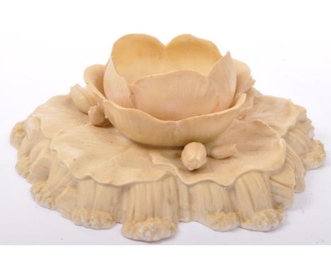 A 19th century first period ceramic lilly dish serving dish / centre piece. Lilly flower and pad leaf design in cream glaze g