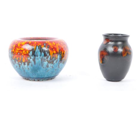 Poole Pottery - Two pieces of Poole Pottery to include a Sea Fire pattern vase alongside a Black Star baluster shaped vase. M