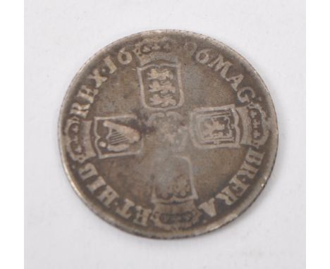 William III Sixpence. Silver, 5.8g, 25mm. Laureate bust right, GVLIELMVS III DEI GRA. R. Crowned cruciform shields, 1696.