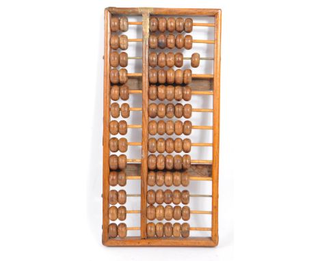 An early 20th century Chinese wooden brass mounted abacus. The abacus being of wooden construction with ornate brass mounts t