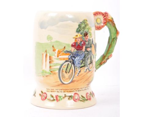 A vintage 20th century ceramic character 'Daisy Bell' musical mug by Crown Devon Fieldings, England. With raised floral decor