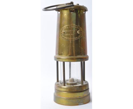 A 20th century brass miners&rsquo; lamp by the Lamp &amp; Limelight Company of Hockley. Complete with hanging hook atop.&nbsp