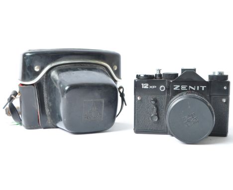 A late 20th century circa 1980s Zenit / Zenith 12 XP 35mm SLR camera. Having black metal body. Serial number 83156791. Made i