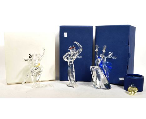 Swarovski - A collection of four vintage 20th century Swarovski crystal glass ornament figures to include 2004 heart alongsid