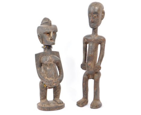 Two early to mid century Kuba / Congolese / African hand carved statues / sculpture figurines of a nude man & women. Both in 