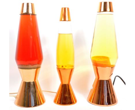 Three original vintage mid 20th century lava desk table lamp lights. The lot comprising of three electrical lava lamps with c