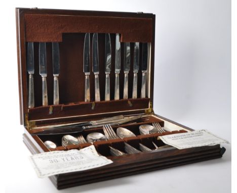 A mid 20th century circa 1970's mahogany cased silver plated (EPNS) canteen set of cutlery by Slack & Barlow, Sheffield Ltd. 