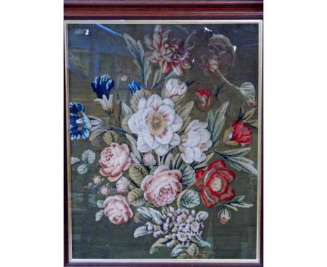 A 19th century stump work tapestry depicting a spray of flowers on a brown wool embroidered background, 63cm by 50cm 