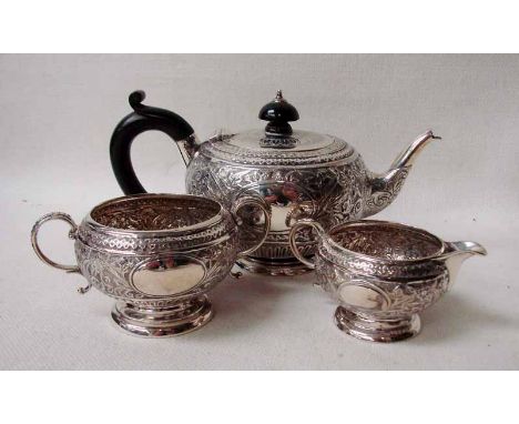 A late Victorian silver three-piece Batchelor tea service by Charles Stuart Harris, London 1888, of footed melon form, each p