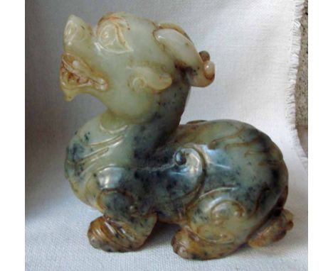 A carved Chinese jade/hardstone sculpture as a Pixou, 14cm high by 12cm long 