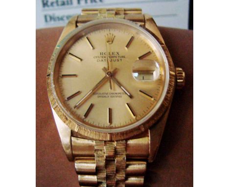 A gentleman's 18k yellow gold Rolex Oyster Perpetual Datejust wrist watch, the signed gilt 30mm dial with baton markers furth