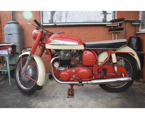 A 1960 Norton Dominator 99 600cc, registration number VCJ 844, frame number R1487865, engine number 87865, red/cream. Introdu