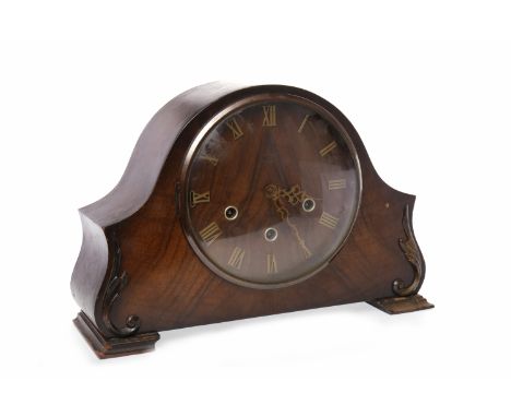 MID-TWENTIETH CENTURY OAK MANTEL CLOCK
with Smith's movement, the circular face with Roman numerals, the curved body with scr